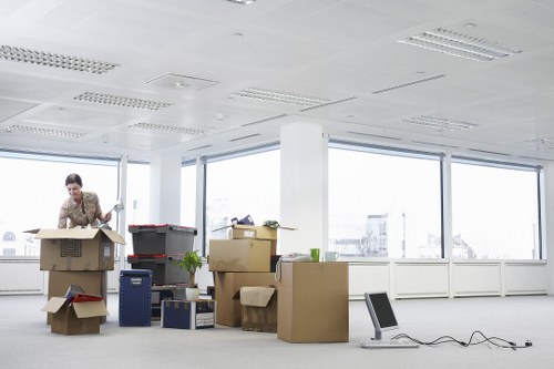 Moving team carefully handling furniture during removals in Whetstone