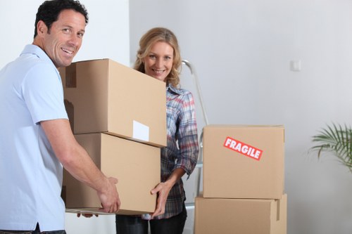 Family packing boxes into a mobile storage container in Whetstone